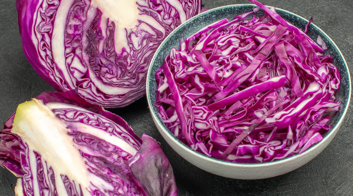 front view sliced red cabbage fresh vegetable on a dark backgrou