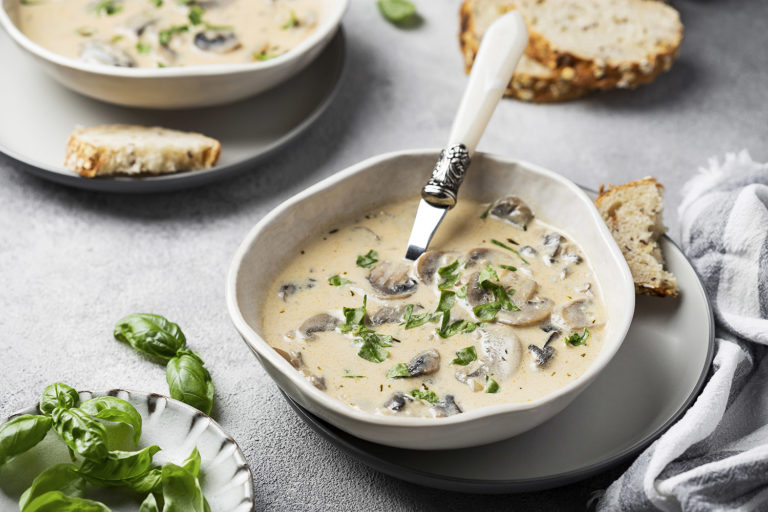 Delicious creamy soup with mushrooms, basil and garlic